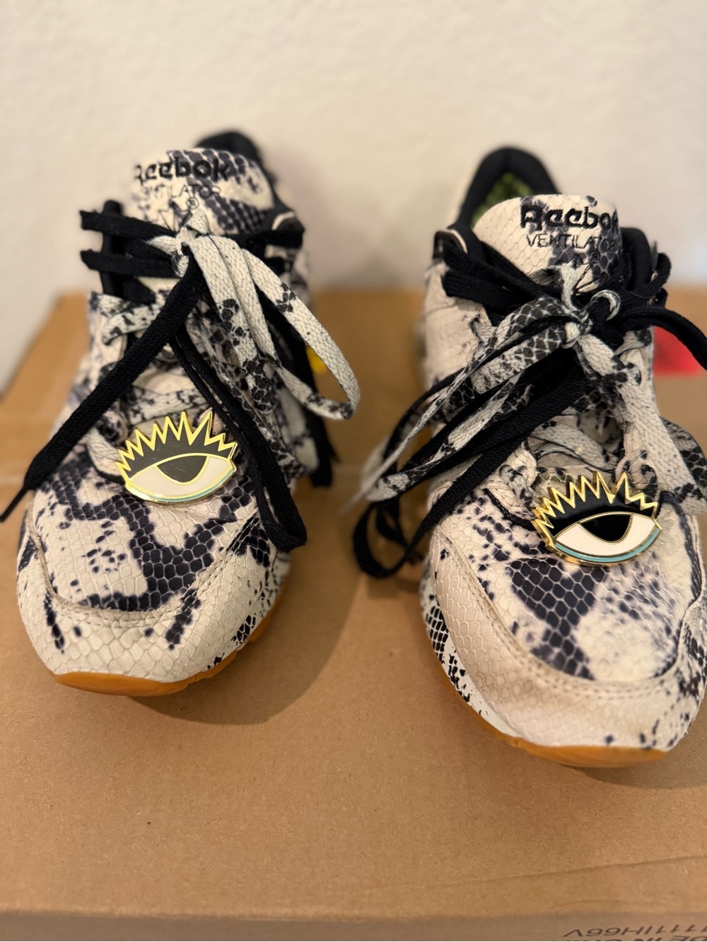 Melody Ehsani Reebok Snake-Print Sneakers in White and Black